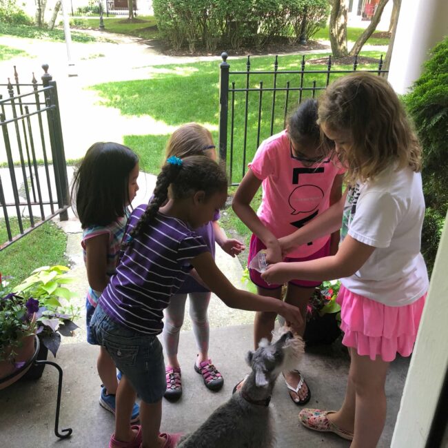 Neighborhood kids brought Boston birthday treats.