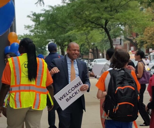 Welcoming students on the first day of school.